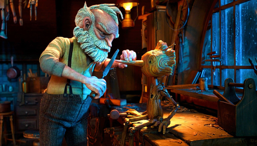 Una scena di Pinocchio (2022) di Guillermo del Toro con Geppetto e Pinocchio