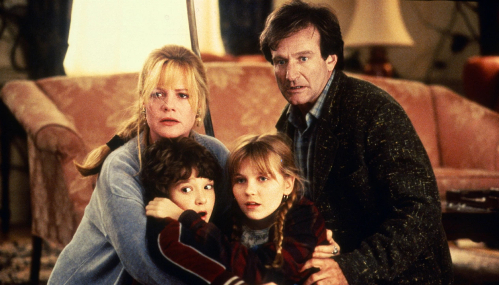 Bradley Pierce, Kirsten Dunst, Robin Williams e Bonnie Hunt in una scena di Jumanji (1995) di Joe Johnston